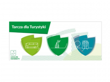 Grafika promująca Tarczę dla Turystyki. Rysunki autobusu, podróżującego człowieka i hotelu widnieją w róznokolorowych tarczach na białym tle